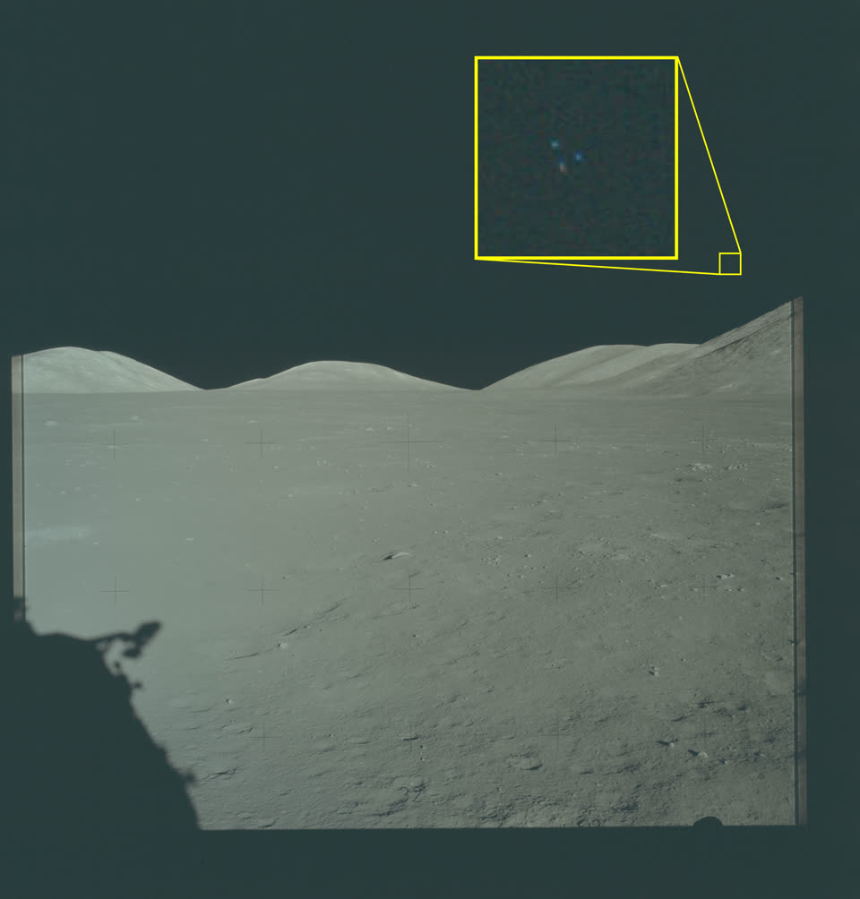 Photograph of the lunar surface showing astronaut shadows and a magnified callout of an object in the sky.