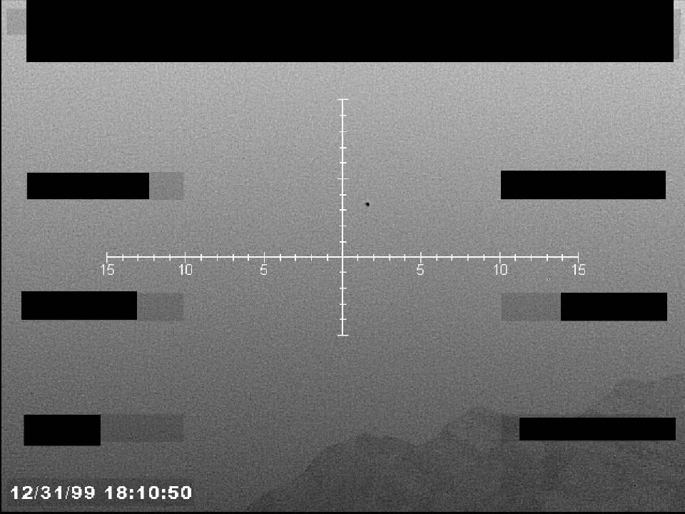 Redacted sensor image with a targeting reticle.